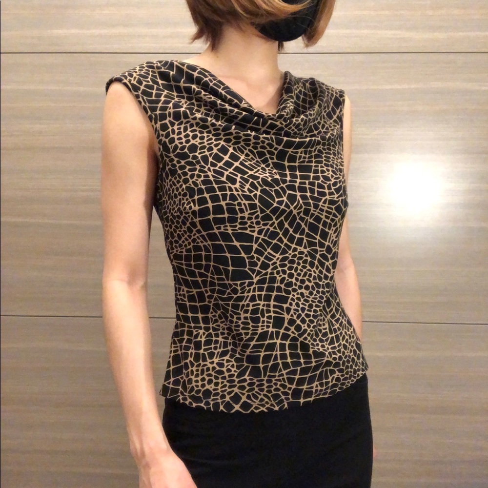 Context, petite small.  Black sleeveless blouse with tan pattern.